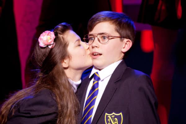 Adrian Mole being kissed by Pandora in the musical