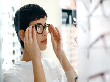 lady trying on glasses