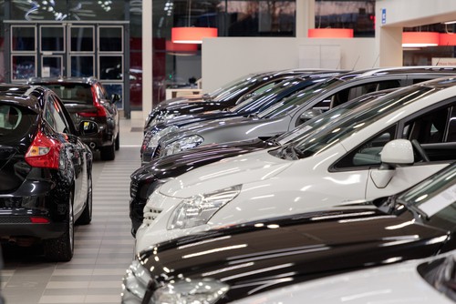 Close-up image of cars lined up in a showroom